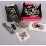 A 1930s silver and marcasite combination dress clip/brooch, a large paste brooch with central raised