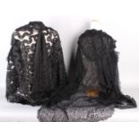 A 19th century black bobbin lace cloak, with original label 'May Hammond, Cadogan Square';