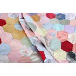 An early to mid 20th century patchwork quilt top, made up of pale 1920s and 1930s lingerie-weight