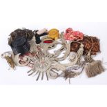 A collection of passementerie, including: a scarf length of red and gold lame, a length of