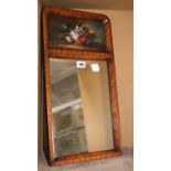 A pair of wooden framed mirrors, each with painted panel, still life of flowers, signed E.M. Ball
