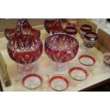 A quantity of cranberry glassware to include a pair of bowls, two baskets and modern glassware