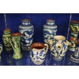 Devonshire ware to include stamped Exeter pottery, vases, candlesticks and a spill vase, in blue and