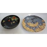 A Carlton ware charger, slip decorated (af) together with a Fielding's Devon ware bowl, black ground