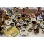 A collection of Torquay Motto ware pottery and other items