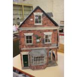A village shop dolls house with furnishings to inside and a yogi bear puppet