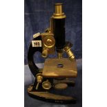 A chrome and black lacquer monocular microscope by Prior of London