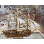A Modern model of a galleon, in a wooden and glazed case, 72.5cm high (in case)