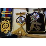 A quantity of Masonic items to include a 9ct medal other medallions and regalia in a box