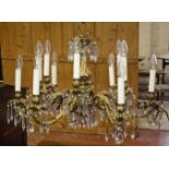 A French 18th Century style brass Chandelier with six double branches with drops