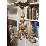 A gilt bronze five light chandelier, late 19th century, the later electrical fitments in urn sockets