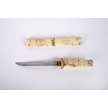 A Japanese Tanto Dagger 19th Century with steel blade and carved ivory grip and scabbard,