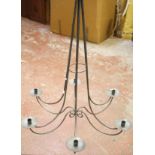 A wrought iron six branch chandelier