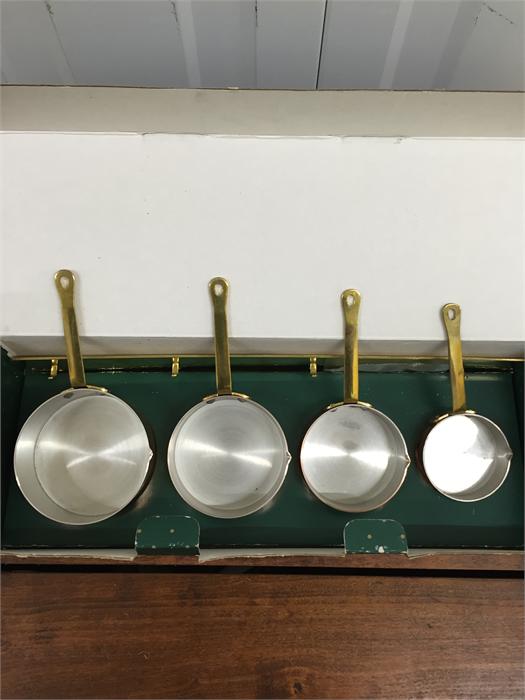 Boxed copper measuring set with brass rack