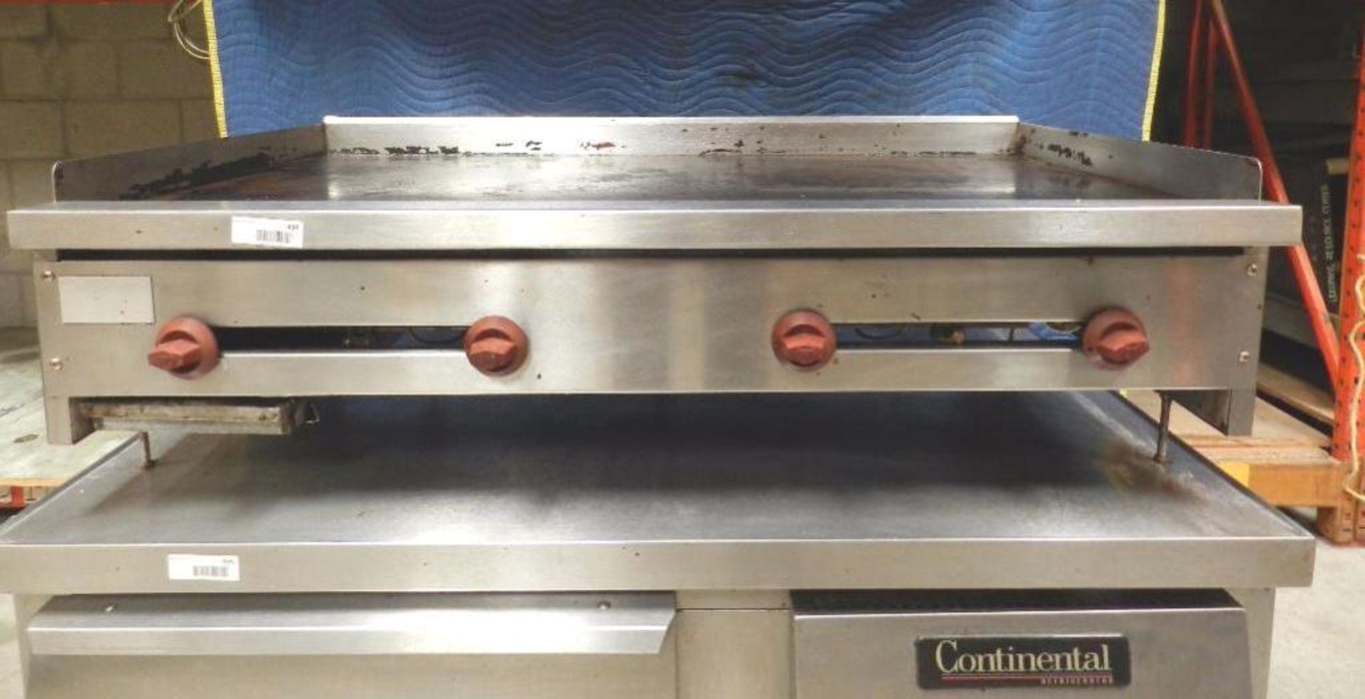 Griddler. Table top type stainless steel griddle . 4 burner gas fueled with splash guard grease prot