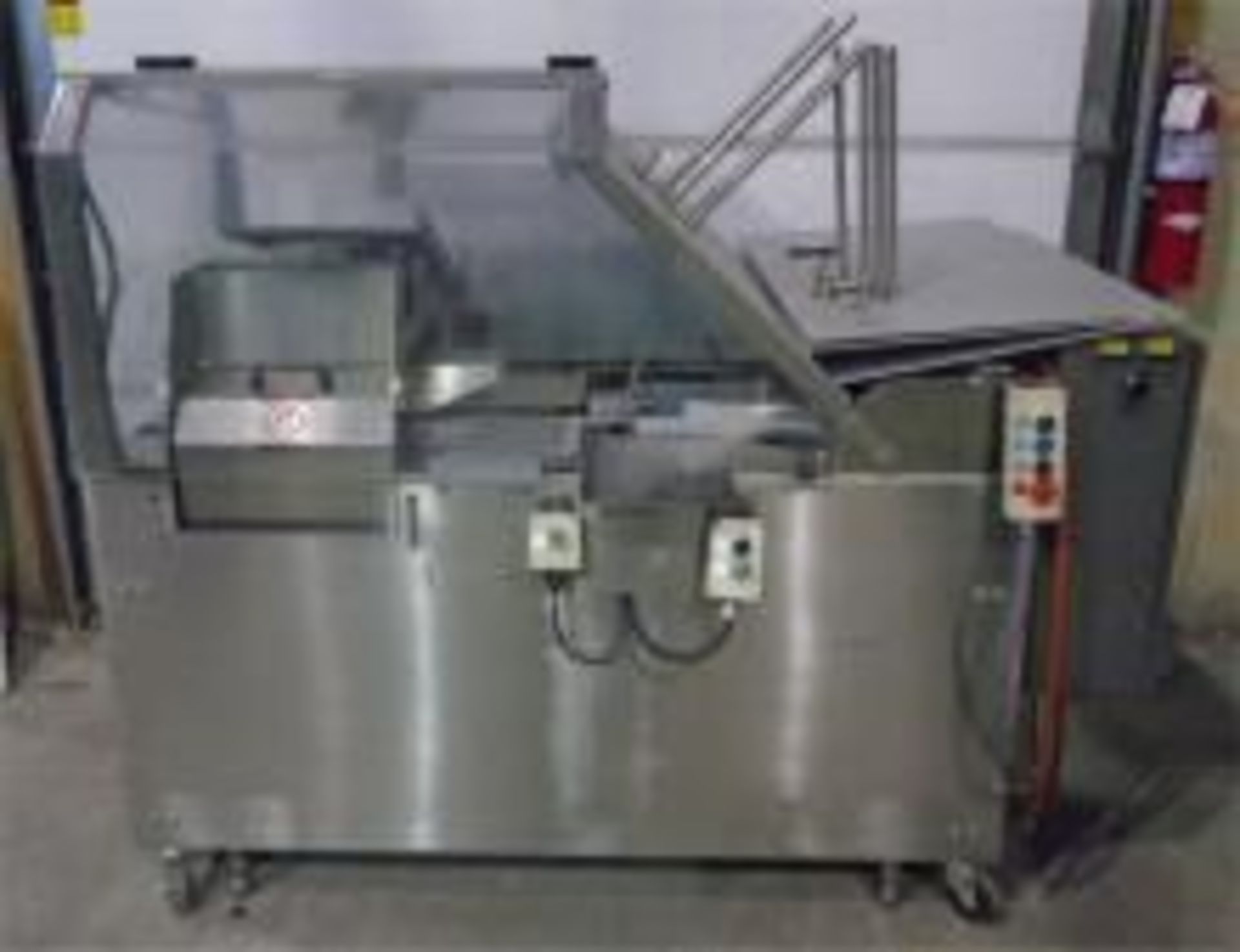 Used Econoseal E-System 2000 Horizontal Cartoner Model 6102. Electrics: 1Ph/60Hz/220Volts.(air