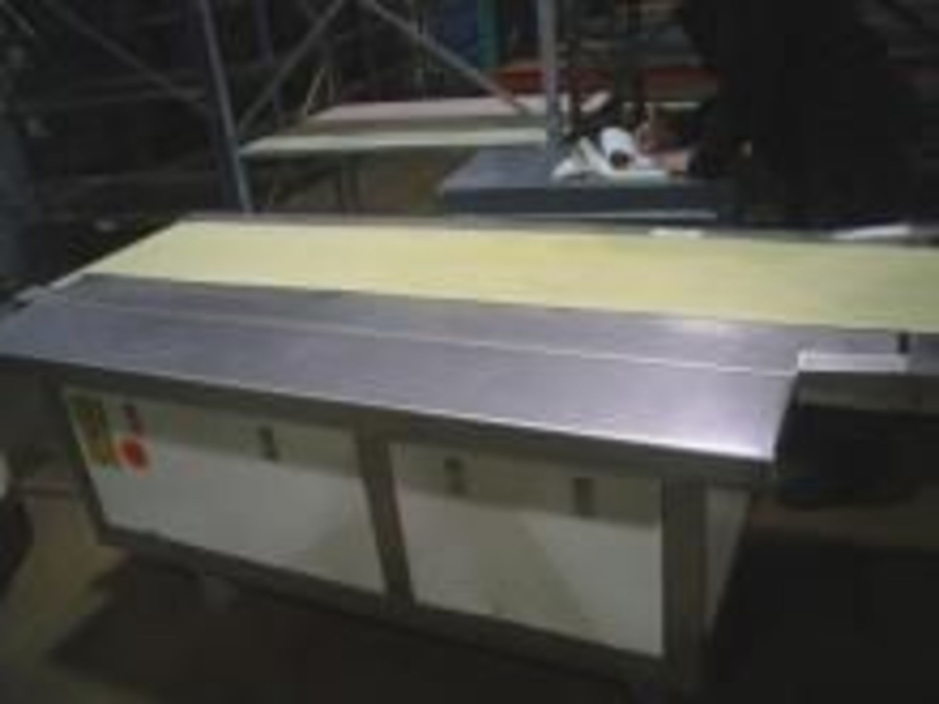 Used 60in long by 14in wide motorized belt Stainless Steel Packing Tables. Overall dimensions: 60"