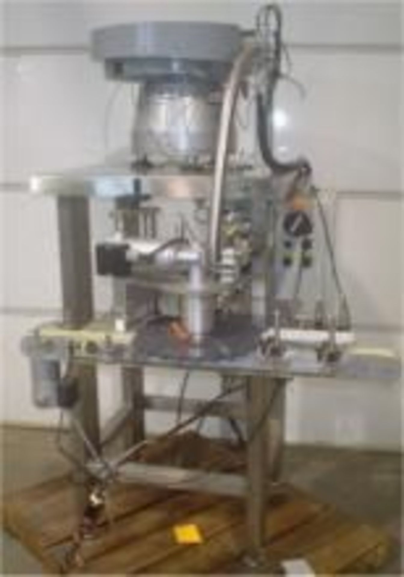 Used DL Tech Rotary Lipstick Inserter. Unit comes with a 35” Long x 2” Wide Rubber Belt and