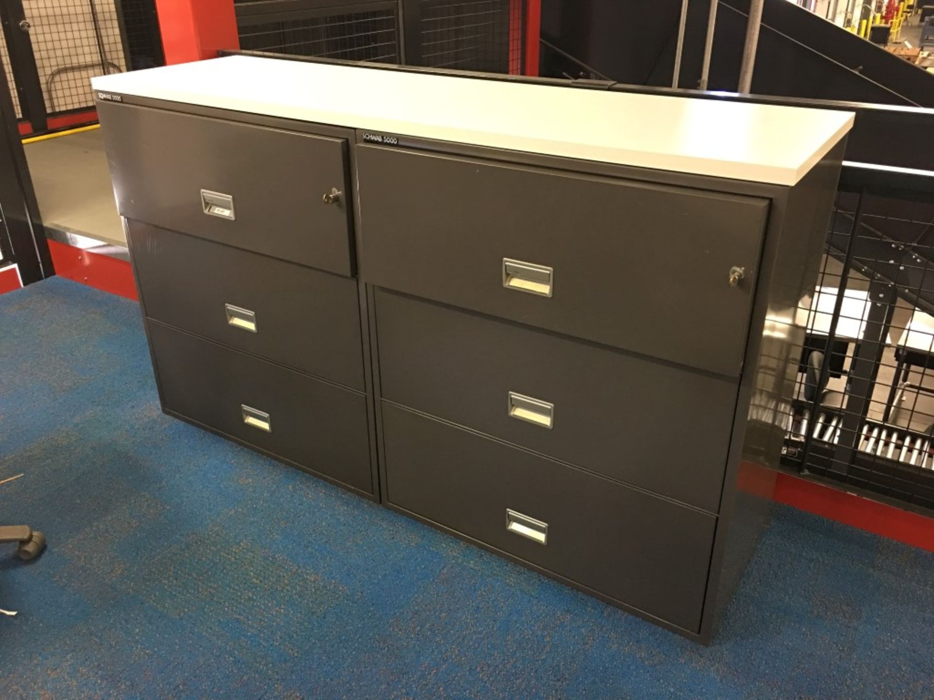 2 PCS OF SCHWAB 5000 FIRE PROOF FILE CABINETS WITH WHITE LAMINATE TABLE TOP. WITH KEYS.