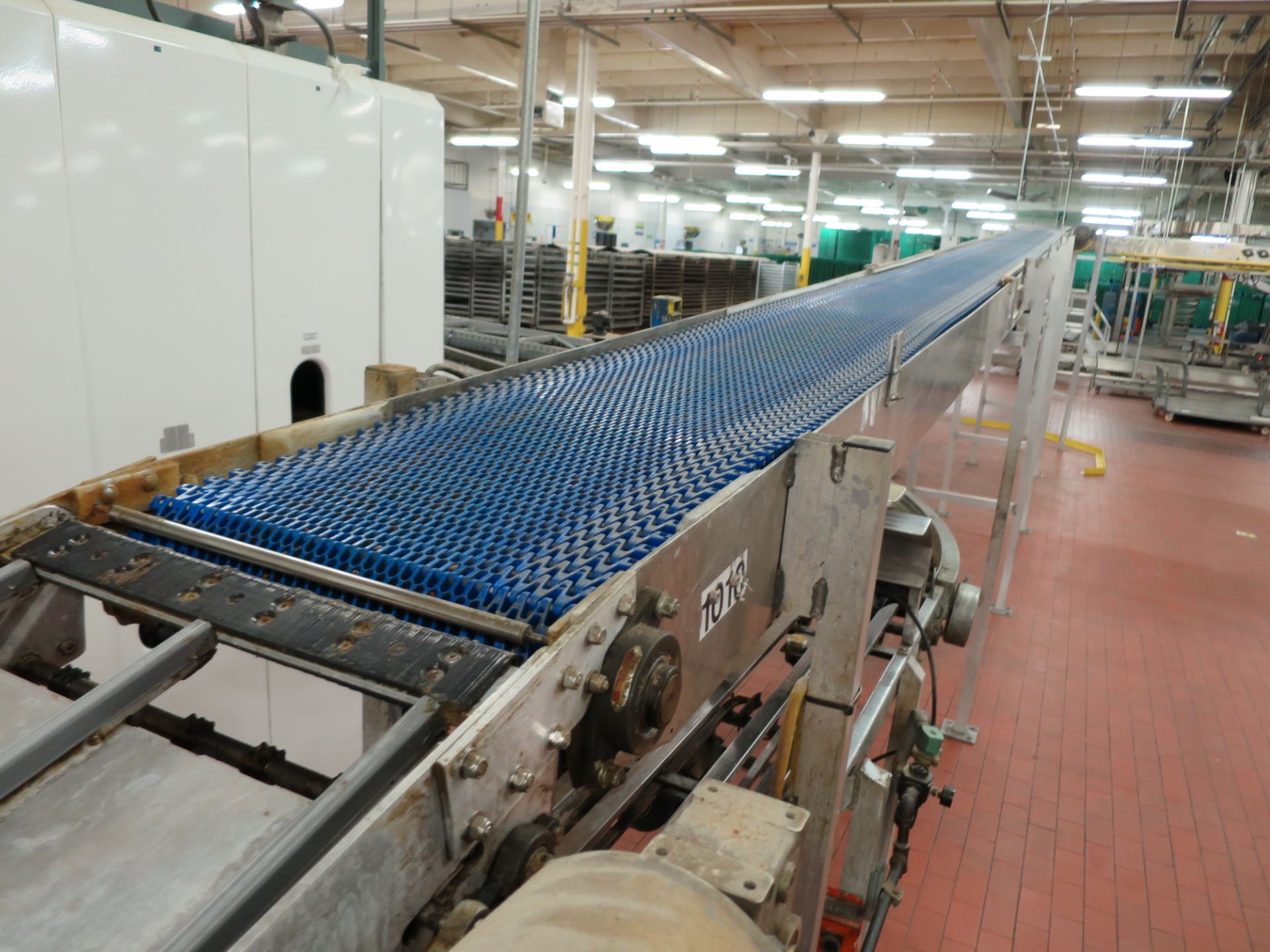 Bread transfer conveyor, 80' long, (1) 90° turn, 18" plastic belt with hydraulic drop down, from