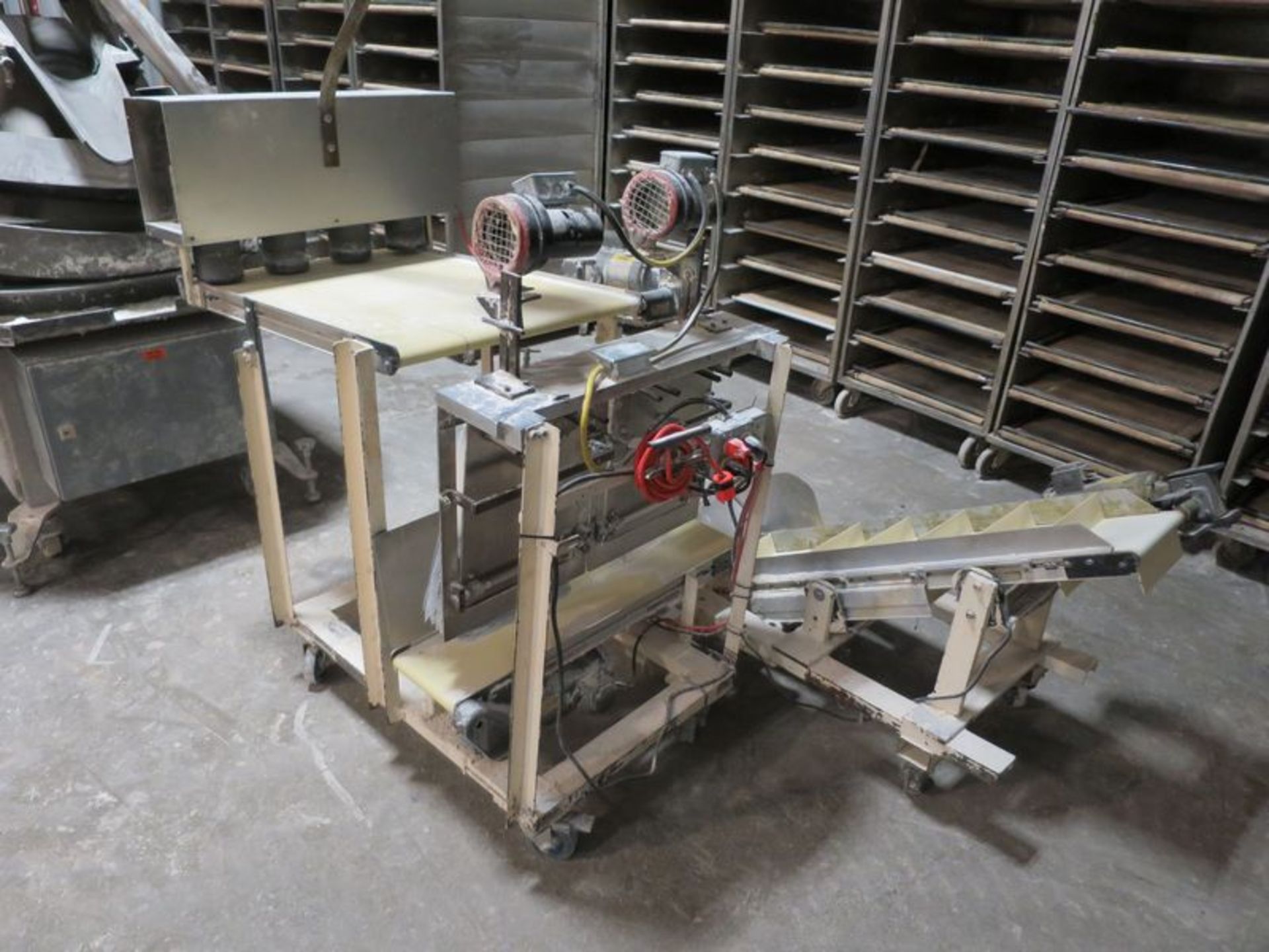 Semi automatic 4 position pizza dough bagger, with cleated belt discharge and mobile base