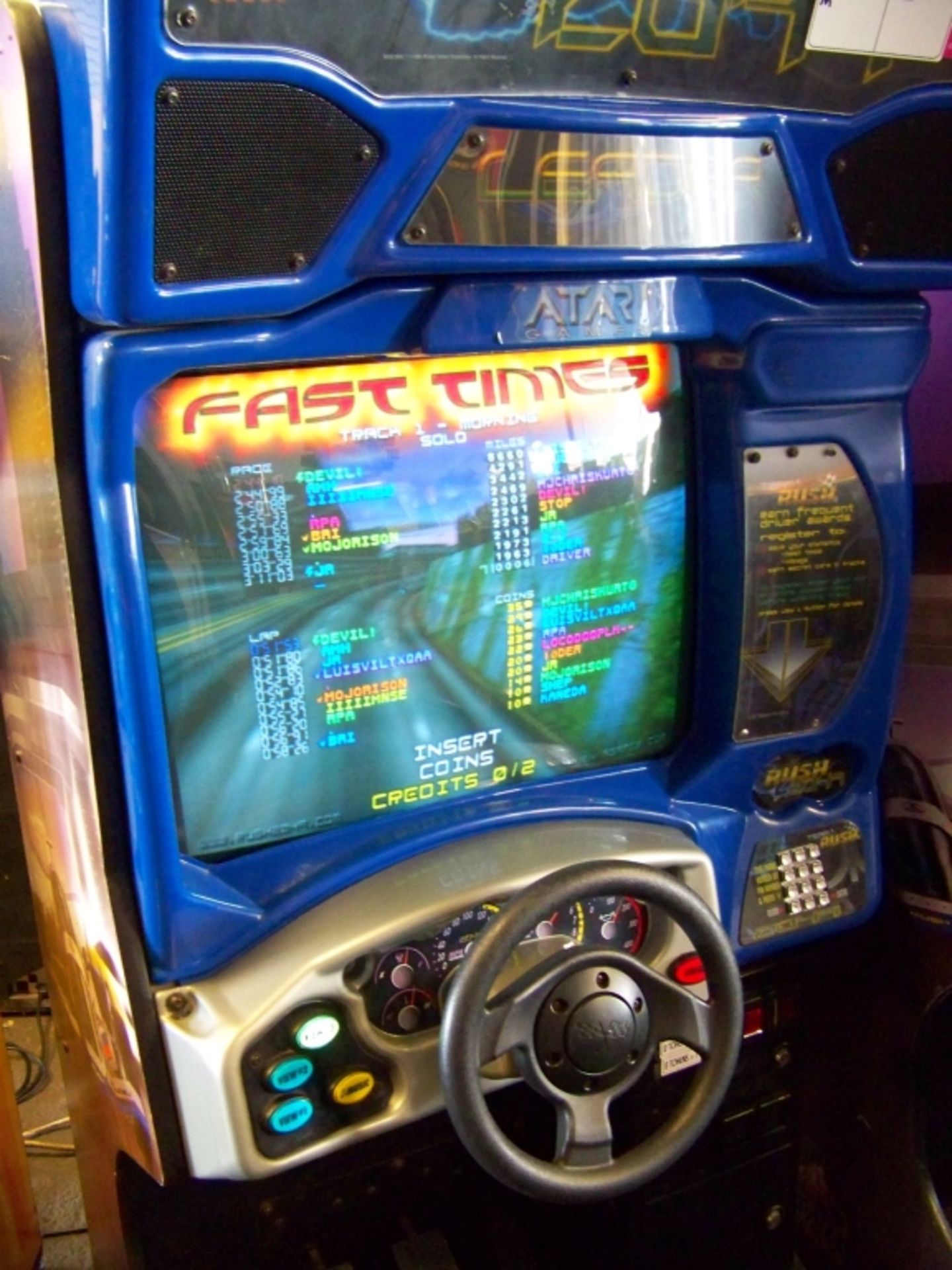 RUSH 2049 SITDOWN RACING ARCADE GAME ATARI Item is in used condition. Evidence of wear and - Image 2 of 4