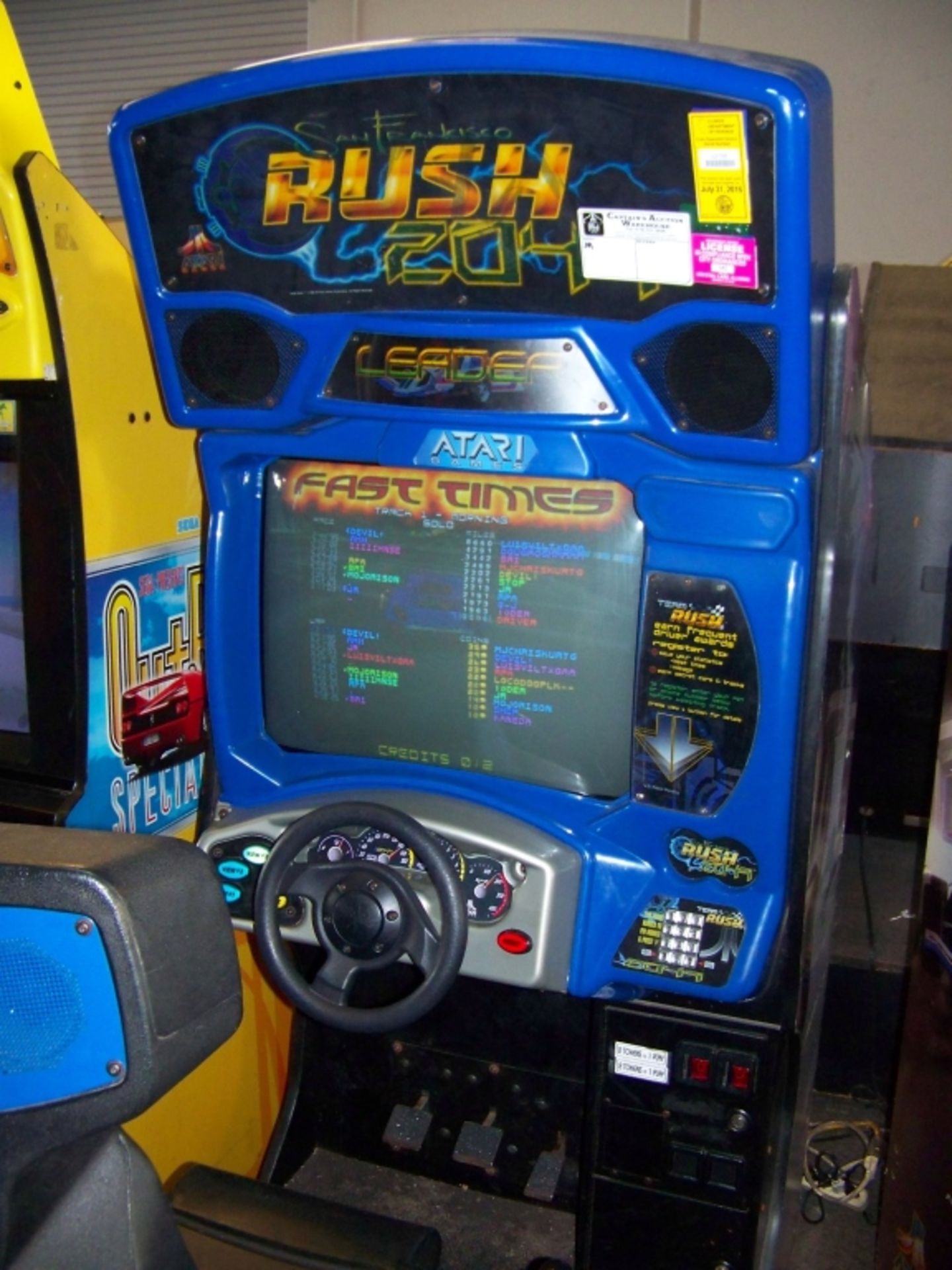 RUSH 2049 SITDOWN RACING ARCADE GAME ATARI Item is in used condition. Evidence of wear and - Image 4 of 4