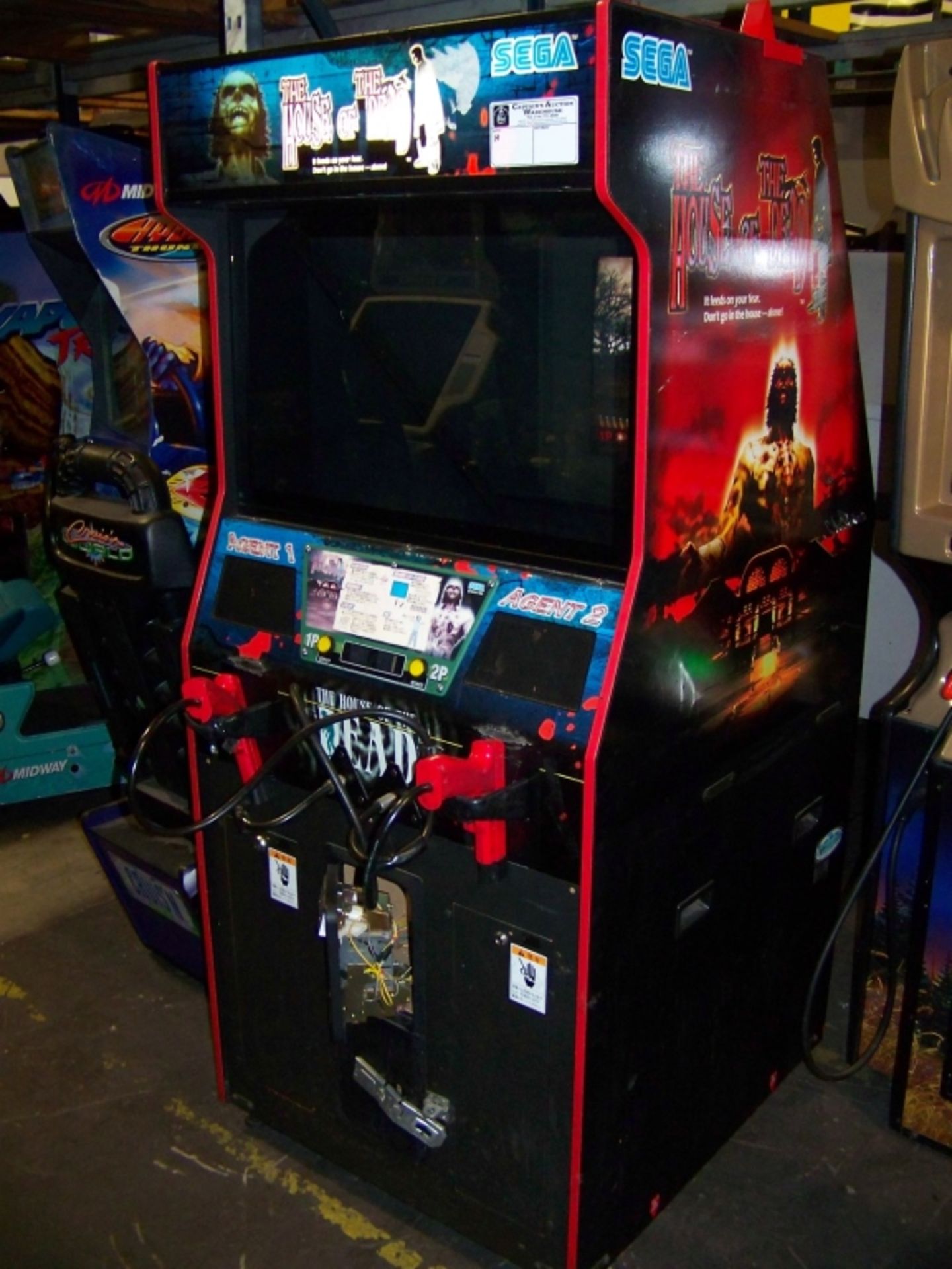 THE HOUSE OF THE DEAD ZOMBIE SHOOTER ARCADE GAME Item is in used condition. Evidence of wear and