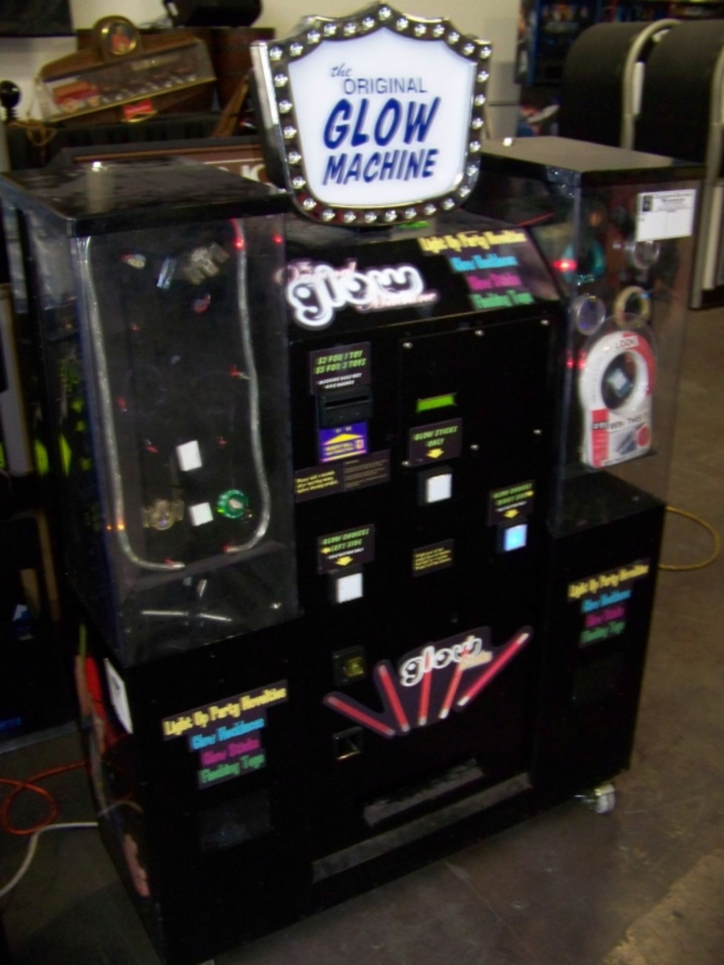 THE ORIGINAL GLOW MACHINE VENDING KIOSK Item is in used condition. Evidence of wear and commercial