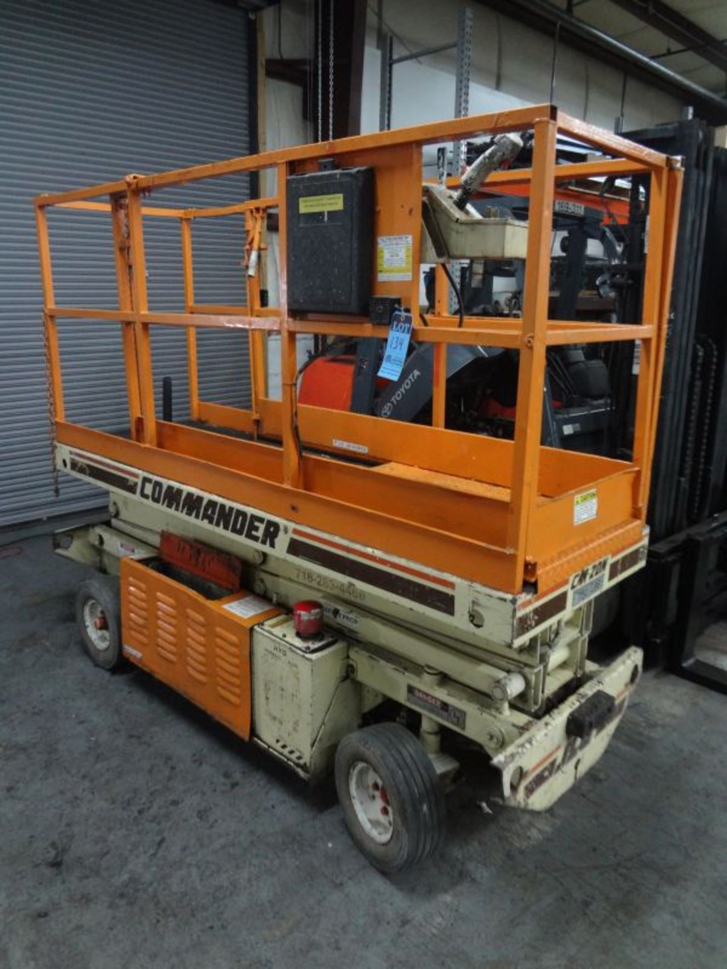 JLG MODEL CM-20N ELECTRIC SCISSOR LIFT; S/N 0208803438, 20' LIFT HEIGHT, 750 LB. CAPACITY, 30"