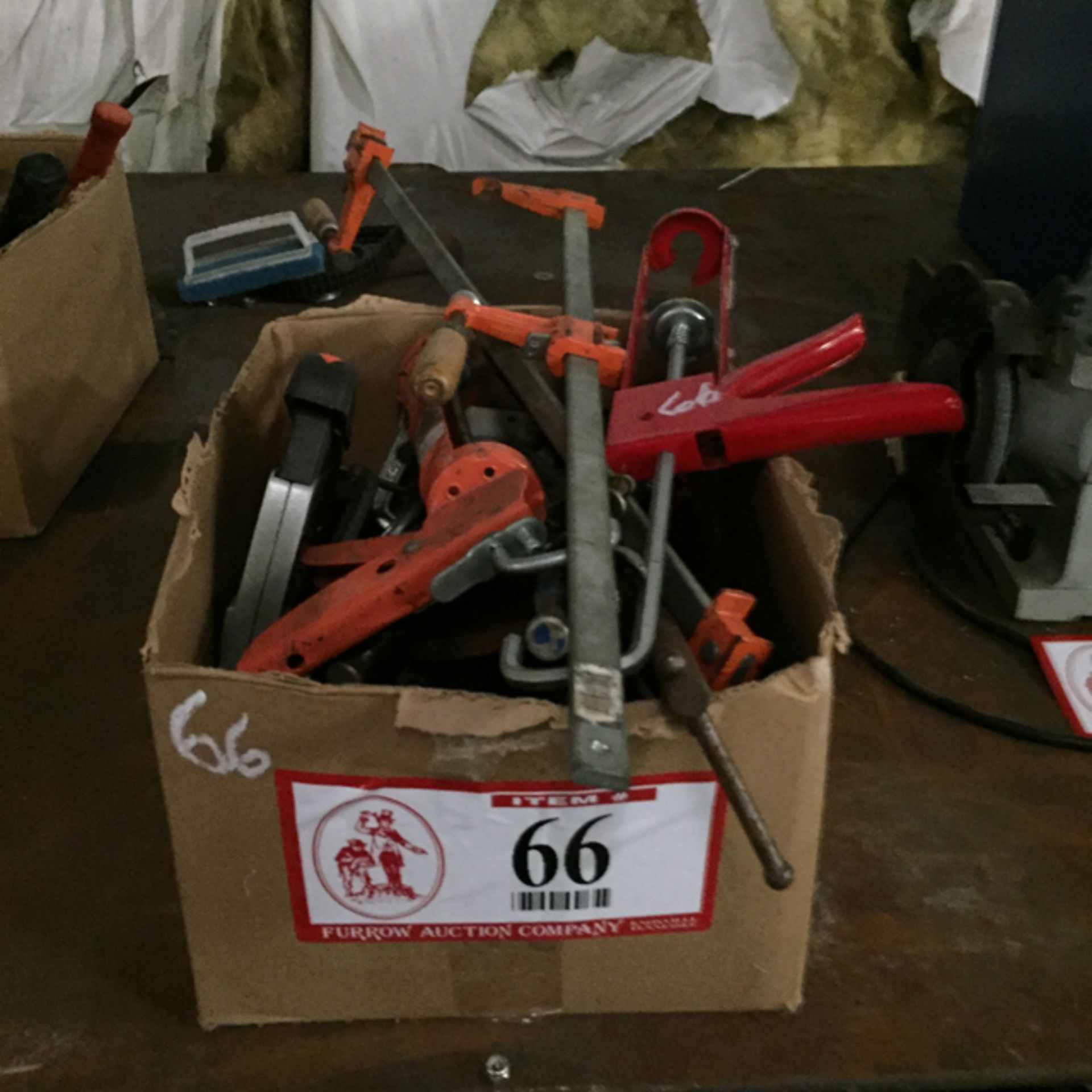 Contents Box, Misc Caulking Guns, (2) Bar Clamps, (2) C-Clamps, etc