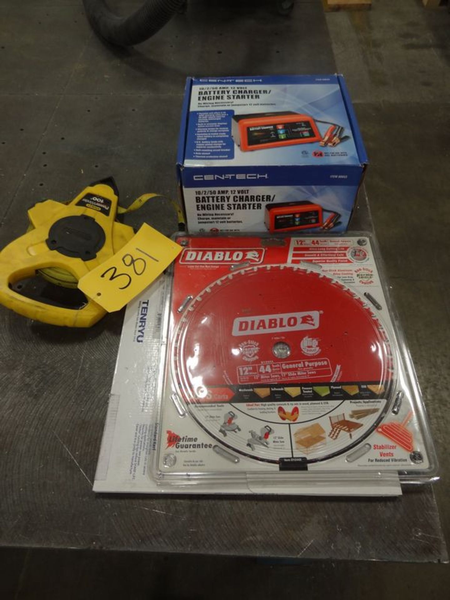 Lot of Battery Charger, Tape Measure, Saw Blade