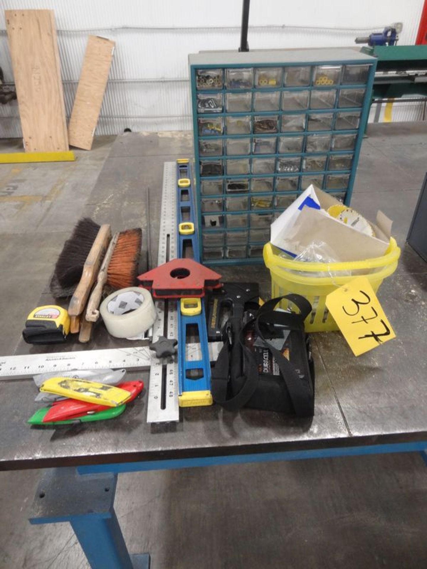 Contents including, Small Parts Bin, Hand Brushes, Level, & T-Square and other items