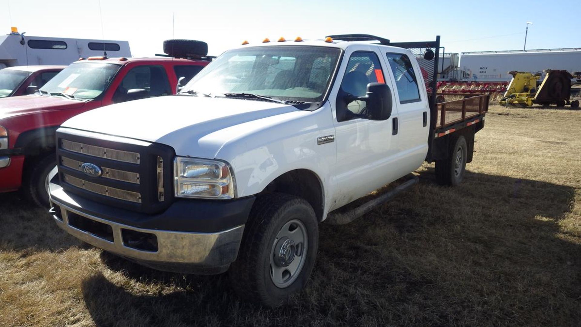 2007 Ford F350 5.4L V8 4 x 4 crew cab flat deck Vin# 1FDSW35527EA50792 showing 41,699 Kms with