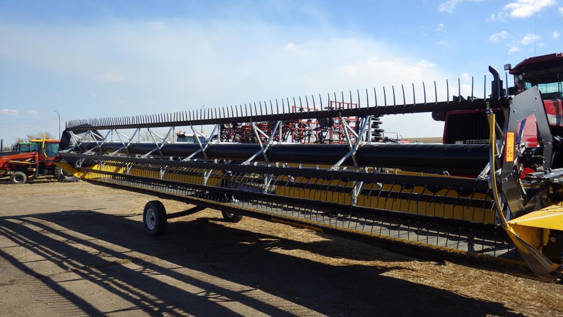 New Holland Combine Draper header with Pea auger, pickup reel. Model 94C Vin# 36GB081197 Approx 36'.