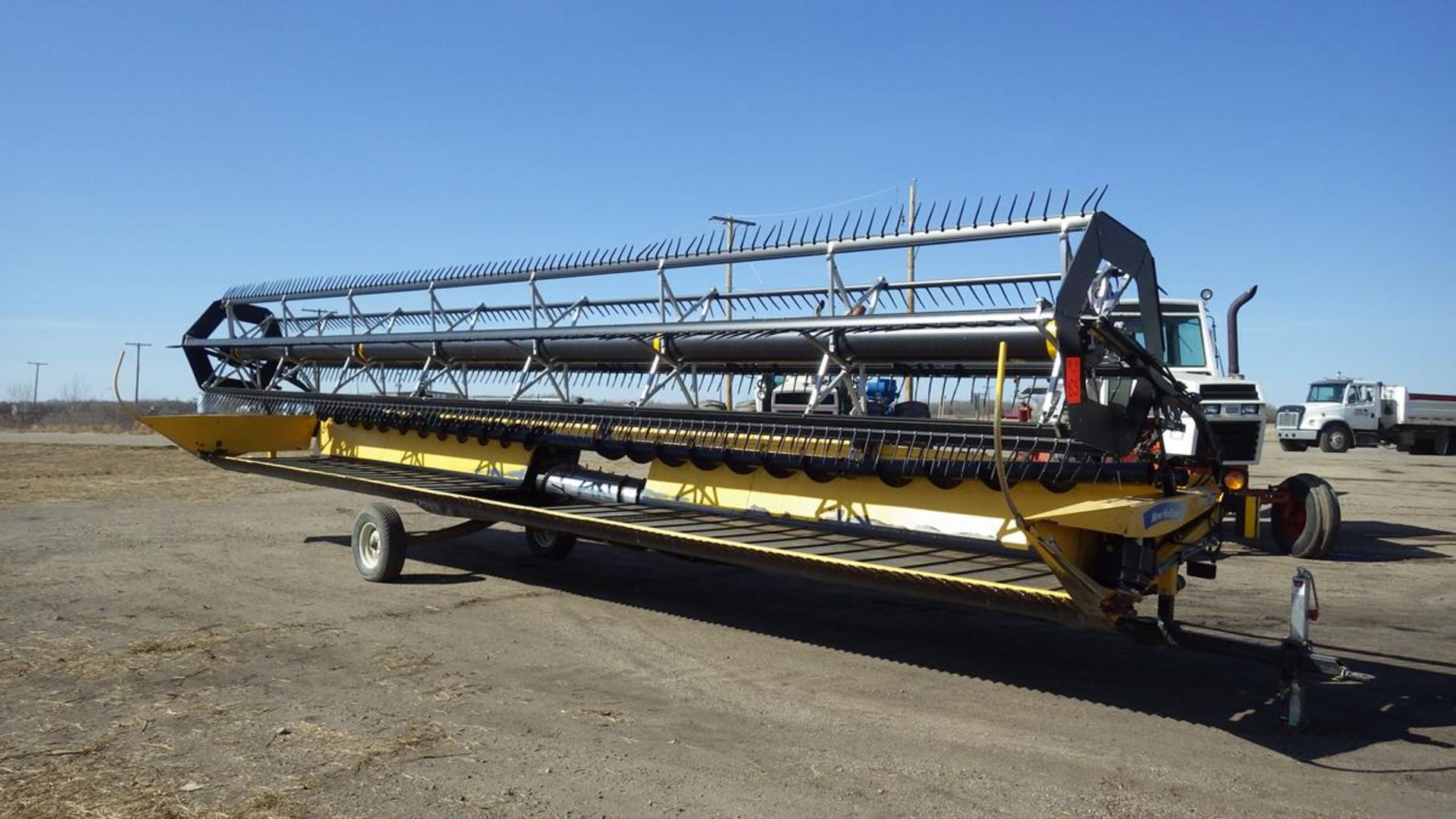 New Holland Combine Draper header with Pea auger, pickup reel. Model 94C Vin# 36GB081201 Approx 36'.