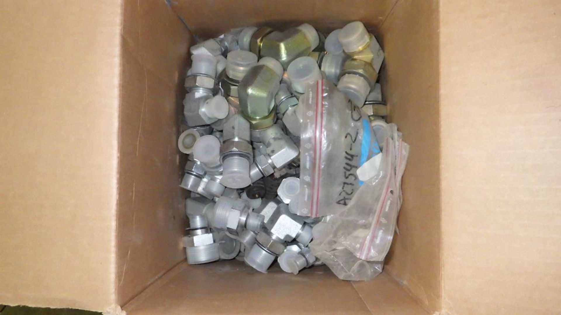 PALLET OF BOXES OF HYDRAULIC FITTINGS, RIGHT ANGLE GEAR DRIVE, CAM LOCKS, GRADER BLADE BOLTS. - Image 5 of 10