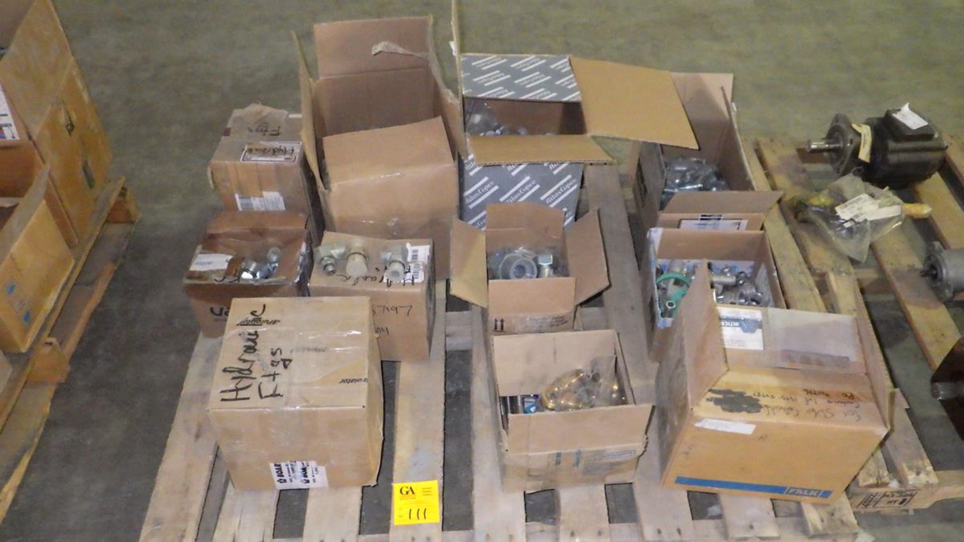 PALLET OF BOXES OF HYDRAULIC FITTINGS, RIGHT ANGLE GEAR DRIVE, CAM LOCKS, GRADER BLADE BOLTS.