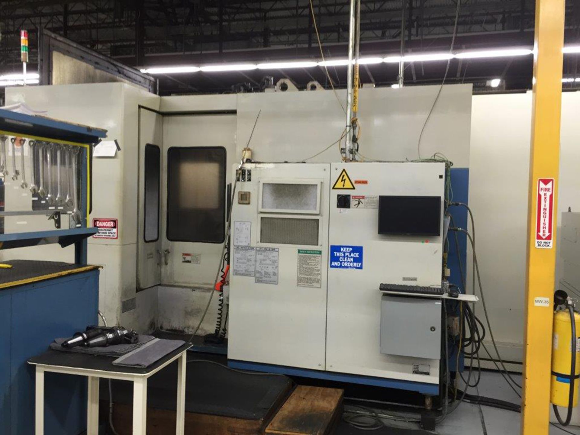 Dual Mazak Model H-630 CNC HMCs in Manufacturing Cell with FMS Pallet Transfer Unit