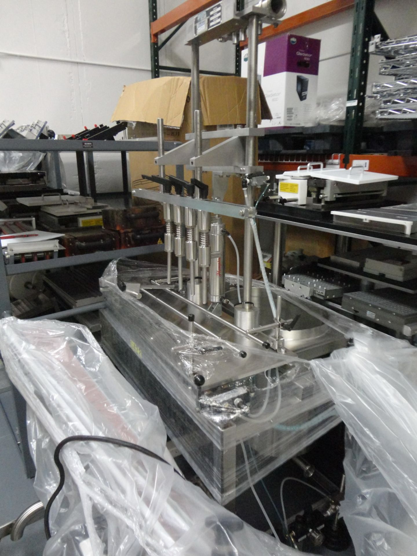 Packaging Dynamics Semiautomatic 4 head pressure/gravity filler, Model B-4C, SN M-9915