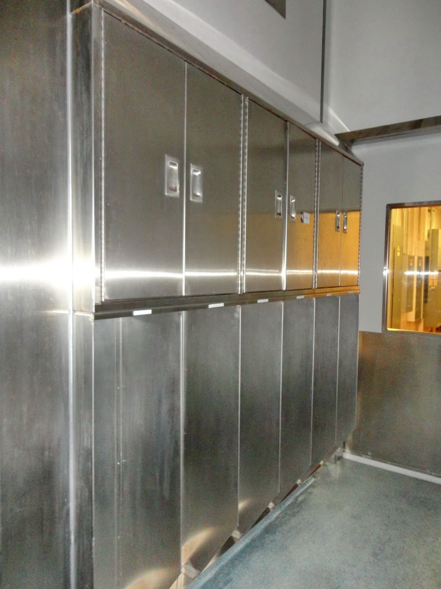 (1) Wall Mounted SS Locker System, 82" wide