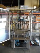 Anake 8 Station Gravity Fed Liquid Filler with 15' variable speed conveyor.  All 316 stainless steel