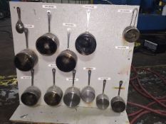 Laboratory stainless steel Measures (12 items) mounted on board (LOCATED IN IOWA, FOB INCLUDED