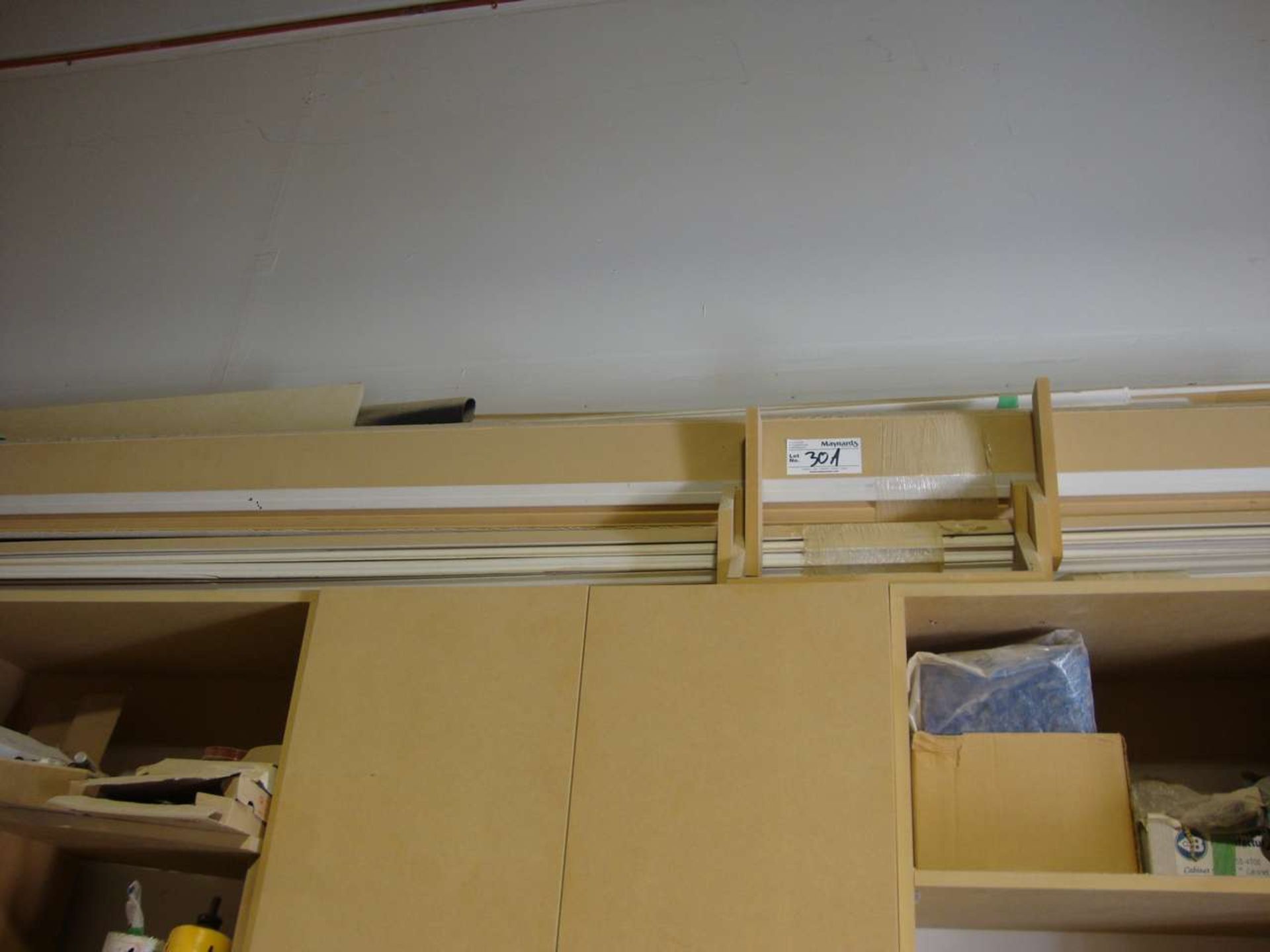 Lot of mouldings and trim on shelf