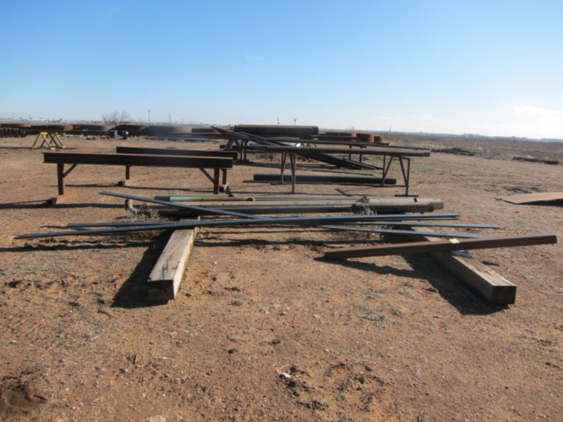 LOT CONSISTING OF: steel pipe & sawhorses (8)