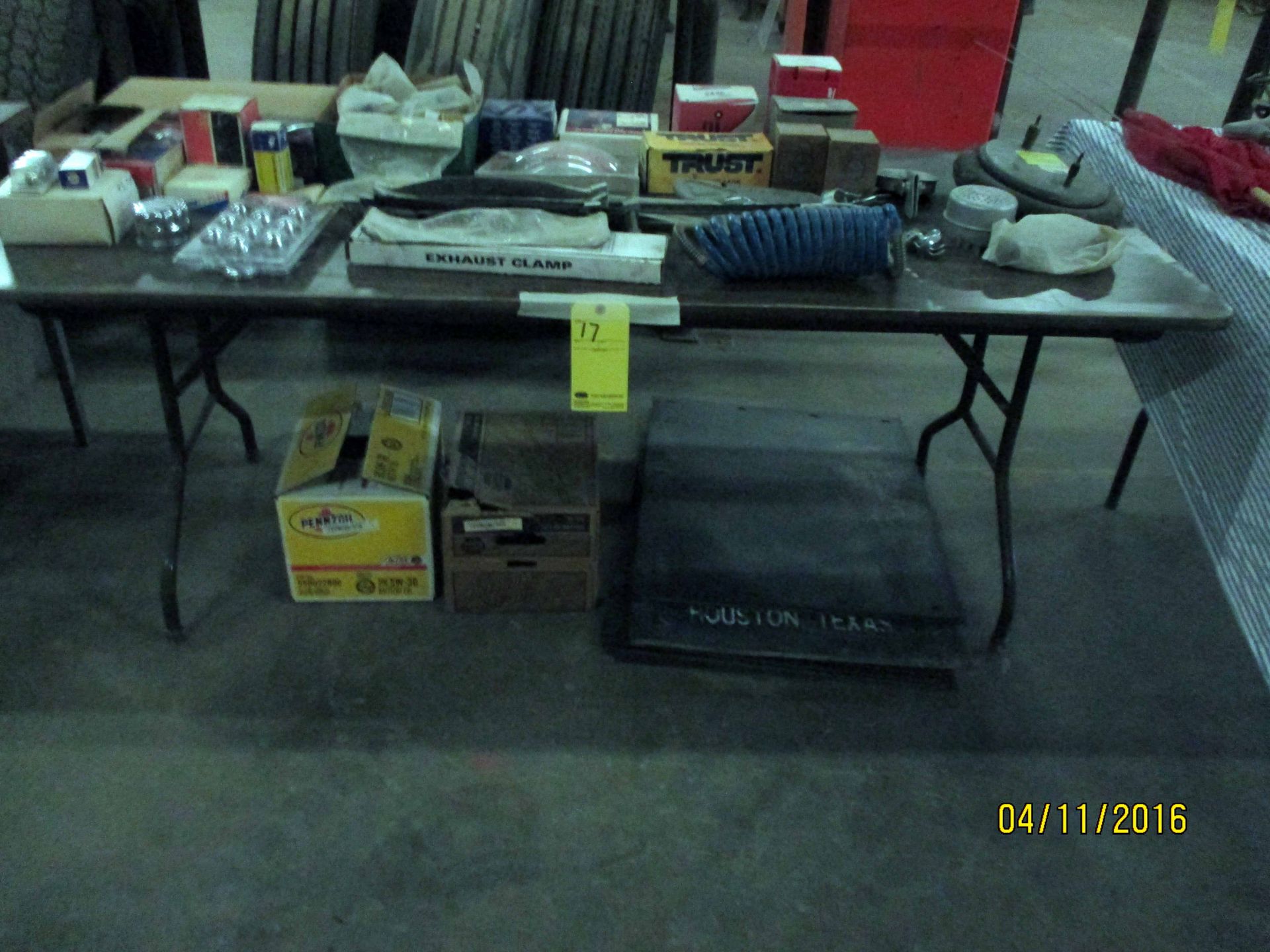 LOT CONSISTING OF: truck parts, engine oil, mud flaps (on folding table)