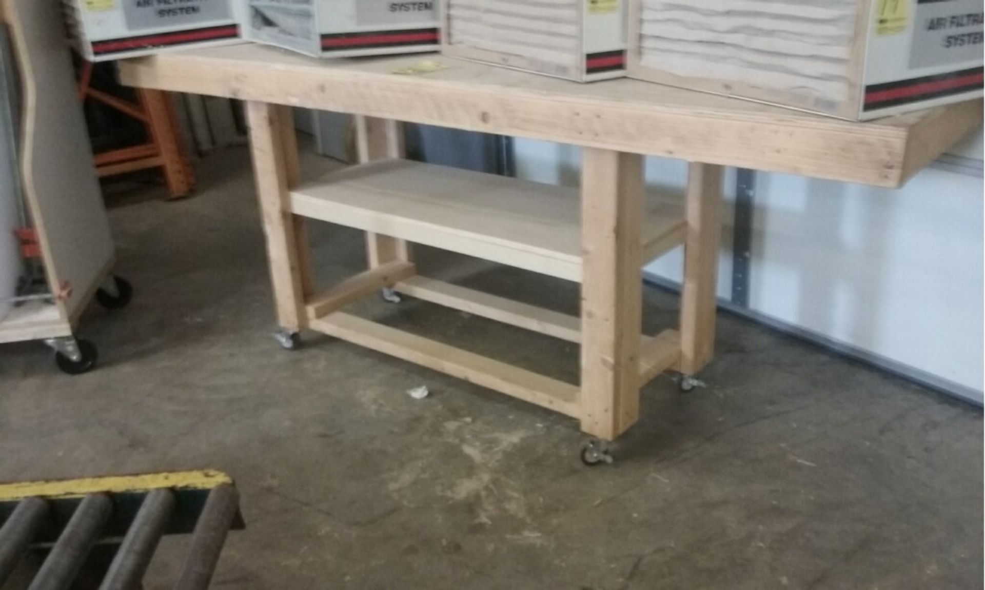 WOODEN TABLE ON CASTERS, 8' X 2'