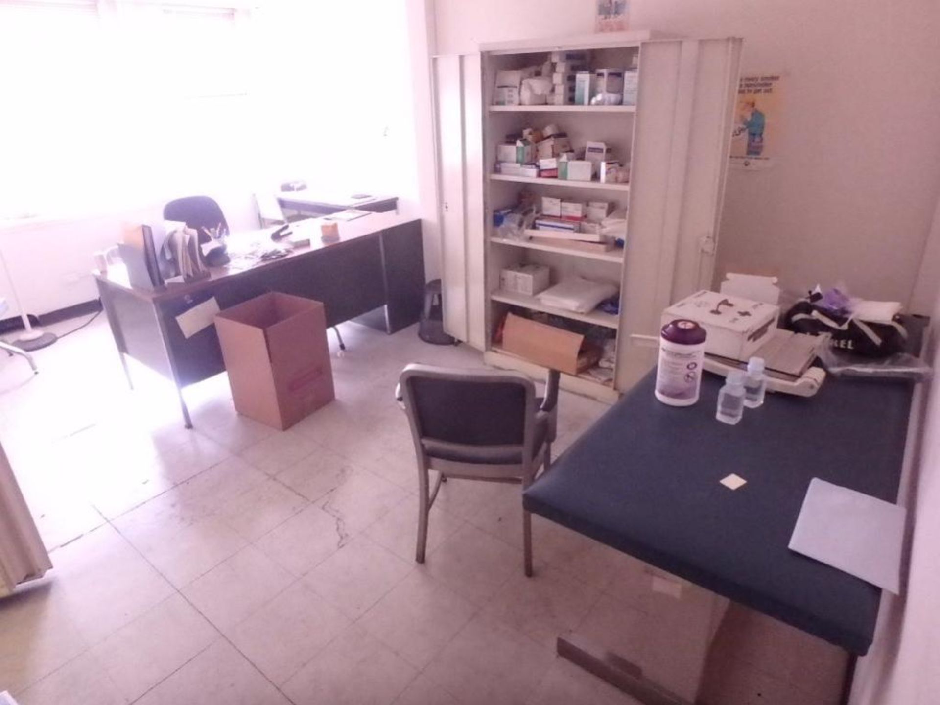 LOT: Contents of Nurses Station Including but Not Limited to: (2) Metal Desks, Patient Table, Storag