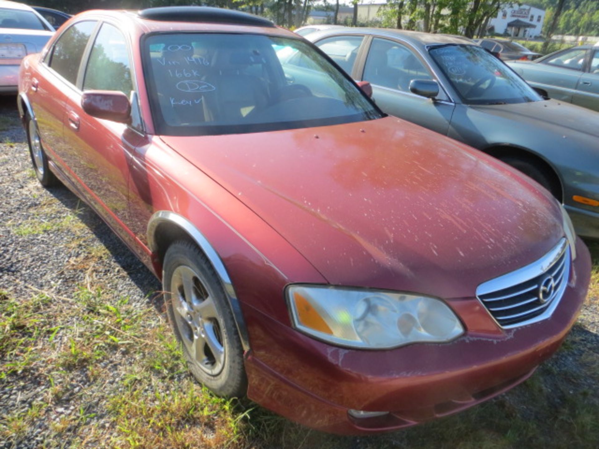 2001 Mazda Millenia-EXHAUST LEAKAGE 166000 MILES,VIN JM11A221211711416, SOLD GOOD TRANSFERABLE TITLE