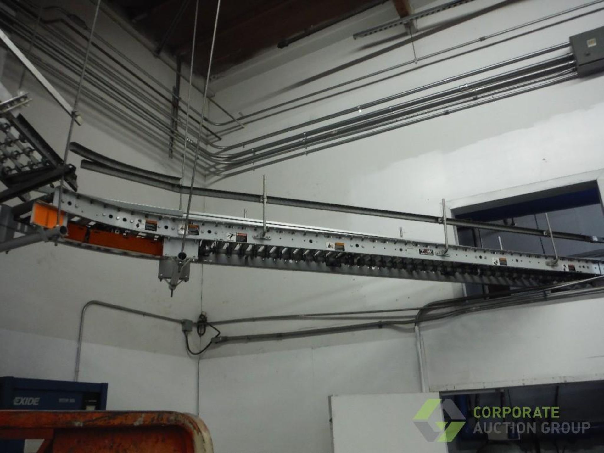 Overhead powered roller conveyor, approx. 60 ft. long x 16 in. wide, with approx. 30 ft. of skate